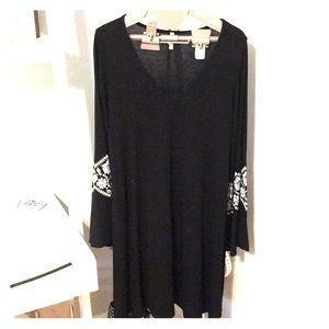 Black maternity dress. Bell sleeves. Floral detail